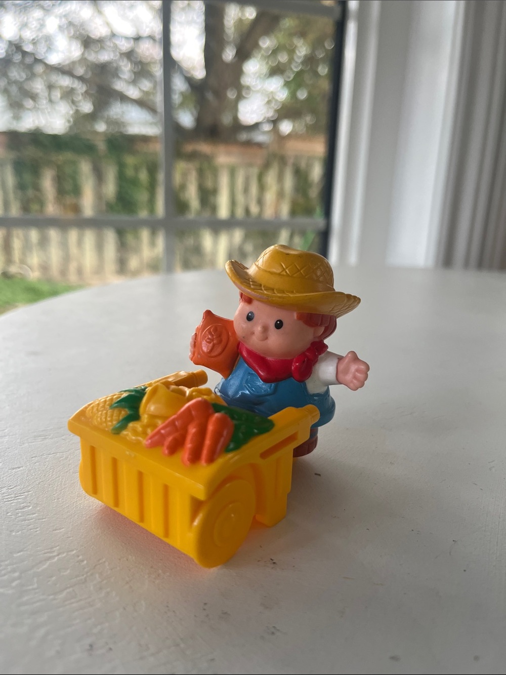 Fisher Price Little People Yellow Farmer Toy with Wheelbarrow
